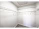 Walk-in closet with painted white walls and wire shelving at 410 Aloha Dr, Henderson, NV 89015