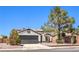 Charming single story home with well-maintained landscaping and a desert-friendly xeriscaped front yard at 410 Aloha Dr, Henderson, NV 89015
