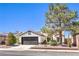 Charming single story home with well-maintained landscaping and a desert-friendly xeriscaped front yard at 410 Aloha Dr, Henderson, NV 89015
