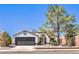 Charming single story home with well-maintained landscaping and a desert-friendly xeriscaped front yard at 410 Aloha Dr, Henderson, NV 89015