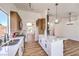 Beautiful kitchen with a large island, stainless appliances, and bright white countertops at 410 Aloha Dr, Henderson, NV 89015