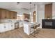 Bright kitchen boasts modern appliances, white countertops, stylish island with bar seating, and contrasting cabinets at 410 Aloha Dr, Henderson, NV 89015