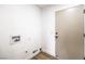 A well-lit laundry room with hookups and a door, ready for appliances and convenience at 410 Aloha Dr, Henderson, NV 89015