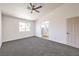 Large main bedroom with carpet, natural light, and access to the bathroom at 410 Aloha Dr, Henderson, NV 89015