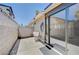 Backyard with a utility sink, white block fencing, and a sliding glass door at 4212 Estaban Ct, Las Vegas, NV 89110