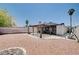 Backyard showing gravel landscaping, a covered patio, and a swing seat at 4212 Estaban Ct, Las Vegas, NV 89110