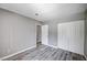 A bedroom with gray walls, wood floors, closet, and white trim is move-in ready at 4212 Estaban Ct, Las Vegas, NV 89110