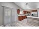 An open kitchen is well-lit and has wooden cabinets, stainless steel appliances, and an island at 4212 Estaban Ct, Las Vegas, NV 89110