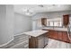 Bright kitchen featuring wooden cabinets, an island with a white countertop, and stainless steel appliances at 4212 Estaban Ct, Las Vegas, NV 89110
