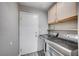 Laundry room complete with a utility sink and newer washer and dryer at 4212 Estaban Ct, Las Vegas, NV 89110