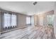 Cozy living room with hardwood floors and large windows, providing ample natural light and a welcoming ambiance at 4212 Estaban Ct, Las Vegas, NV 89110