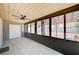 Sun room with tile floors, ceiling fan, natural light, and access to the backyard at 4212 Estaban Ct, Las Vegas, NV 89110