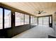 Sun room with tile floors, ceiling fan, natural light, and access to the backyard at 4212 Estaban Ct, Las Vegas, NV 89110
