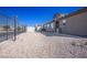 Large, fenced backyard with desert landscaping and room for activities at 4314 Flaming Ridge Trl, Las Vegas, NV 89147