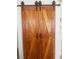 This unique barn door adds a rustic touch to the interior design and style of this beautiful home at 4314 Flaming Ridge Trl, Las Vegas, NV 89147