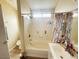 Bright bathroom featuring a tub, shower, and vanity with countertop space, ready for relaxation and convenience at 4314 Flaming Ridge Trl, Las Vegas, NV 89147
