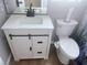 Well-lit bathroom featuring a sleek vanity with modern fixtures and a toilet with an integrated bidet at 4314 Flaming Ridge Trl, Las Vegas, NV 89147