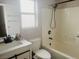Bright bathroom featuring modern fixtures, a combination shower and tub, and ample vanity space at 4314 Flaming Ridge Trl, Las Vegas, NV 89147