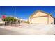 Charming single-story home featuring a spacious driveway and landscaped front yard at 4314 Flaming Ridge Trl, Las Vegas, NV 89147