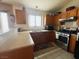 Bright kitchen with stainless steel appliances, light-colored cabinets, a large window, and laminate countertops at 4314 Flaming Ridge Trl, Las Vegas, NV 89147