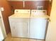 Efficient laundry area featuring a side-by-side washer and dryer for convenient home care at 4314 Flaming Ridge Trl, Las Vegas, NV 89147