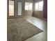 Inviting space featuring tile flooring, with doors opening to the outside, complemented by ample natural light at 4314 Flaming Ridge Trl, Las Vegas, NV 89147