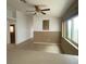 Bright living area boasts a ceiling fan, neutral walls, and tile flooring for a clean and inviting atmosphere at 4314 Flaming Ridge Trl, Las Vegas, NV 89147