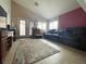 Spacious living room with tile floors, multiple windows for natural light, and comfortable seating at 4314 Flaming Ridge Trl, Las Vegas, NV 89147