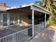 Covered back patio area with a railing, offering an outdoor living space at 4928 E Philadelphia Ave, Las Vegas, NV 89104