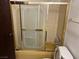 Bathroom featuring a shower with gold frame at 4928 E Philadelphia Ave, Las Vegas, NV 89104