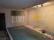 Spacious bedroom with natural light and tiled flooring at 4928 E Philadelphia Ave, Las Vegas, NV 89104