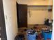 Cluttered bedroom showing personal items scattered on the floor and within the closet at 4928 E Philadelphia Ave, Las Vegas, NV 89104
