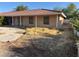 Single-story home with a red tile roof, beige stucco exterior, and front yard with desert landscaping at 4928 E Philadelphia Ave, Las Vegas, NV 89104
