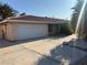 Spacious two-car garage with a long driveway, offering ample parking space at 4928 E Philadelphia Ave, Las Vegas, NV 89104