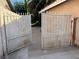 Wrought iron gate allowing access to the backyard at 4928 E Philadelphia Ave, Las Vegas, NV 89104