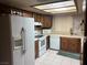 Bright kitchen with tile floors, stainless steel appliances, and classic cabinets at 4928 E Philadelphia Ave, Las Vegas, NV 89104