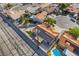 Drone view of a home featuring solar panels, a patio, and a well-kept yard near a pool at 5417 Bible Cir, North Las Vegas, NV 89031