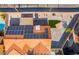 Top-down view of a house with solar panels, a patio, and xeriscaping in the backyard at 5417 Bible Cir, North Las Vegas, NV 89031
