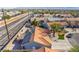 Wide aerial view of a home with solar panels, tile roof, and lush palm trees in a suburban neighborhood at 5417 Bible Cir, North Las Vegas, NV 89031