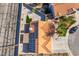 Overhead shot of a property with solar panels, a tile roof, and a landscaped yard at 5417 Bible Cir, North Las Vegas, NV 89031