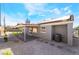 Landscaped backyard features a covered patio and desert landscaping at 5417 Bible Cir, North Las Vegas, NV 89031