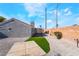 Landscaped backyard featuring gravel, privacy walls, and artificial grass at 5417 Bible Cir, North Las Vegas, NV 89031