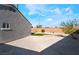 Gravel backyard with privacy wall and small patch of artificial grass at 5417 Bible Cir, North Las Vegas, NV 89031