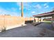 Backyard featuring gravel landscaping, privacy walls, and a covered patio at 5417 Bible Cir, North Las Vegas, NV 89031