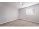 A bright, carpeted bedroom with a window letting in natural light at 5417 Bible Cir, North Las Vegas, NV 89031