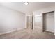 Bright carpeted bedroom featuring a closet with sliding mirror doors at 5417 Bible Cir, North Las Vegas, NV 89031