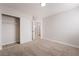 Bedroom featuring neutral carpet, an ensuite bathroom, and walk-in closet at 5417 Bible Cir, North Las Vegas, NV 89031