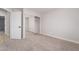 A neutral bedroom with carpet, a door, and a mirrored sliding closet at 5417 Bible Cir, North Las Vegas, NV 89031