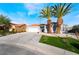 Charming single-story home features desert landscaping, two palm trees, and a two-car garage at 5417 Bible Cir, North Las Vegas, NV 89031