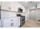 Modern kitchen with stainless steel appliances, white cabinets, and a sleek design at 5417 Bible Cir, North Las Vegas, NV 89031